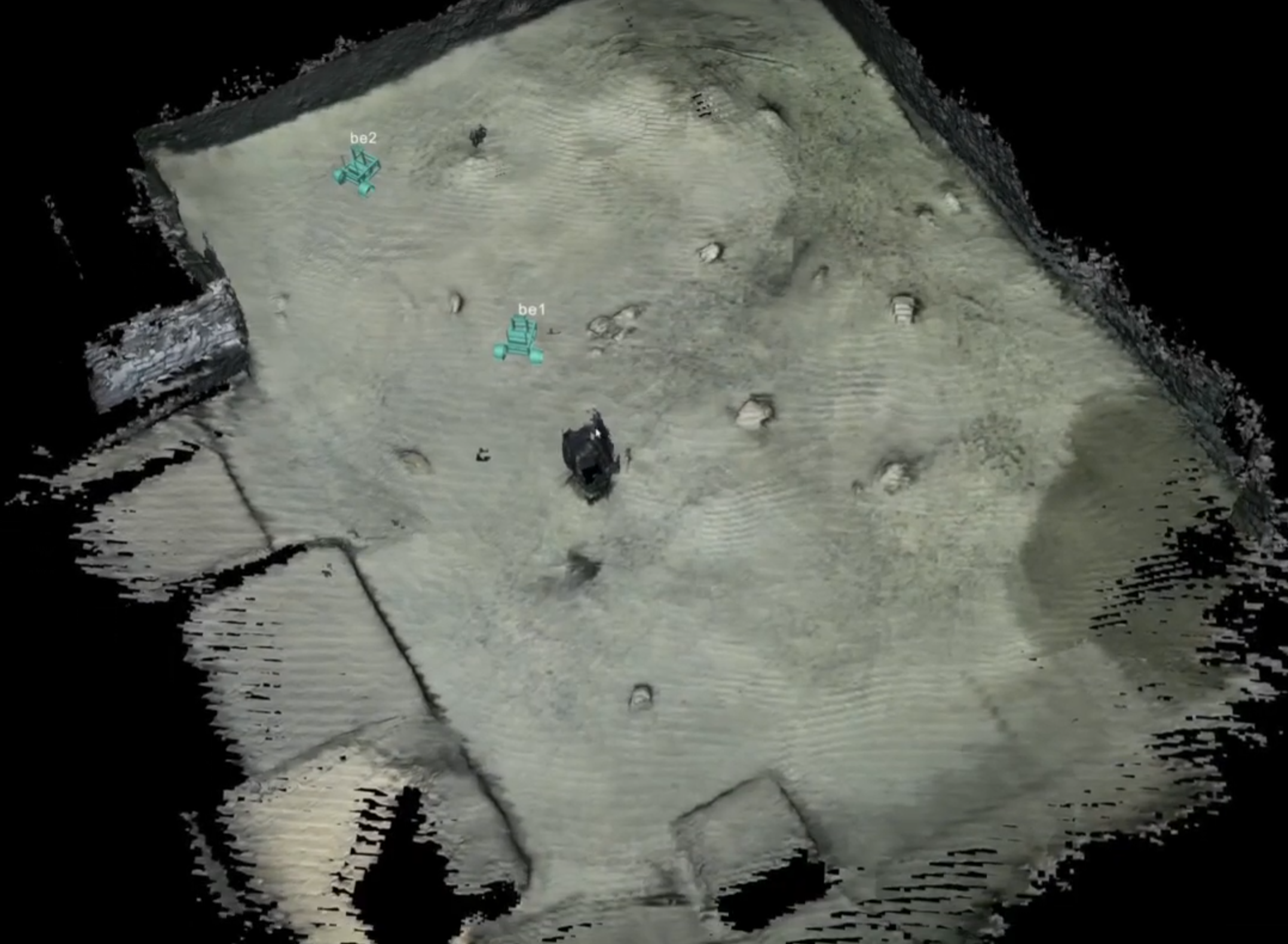 A shared 3D reconstruction built from the views of multiple rovers